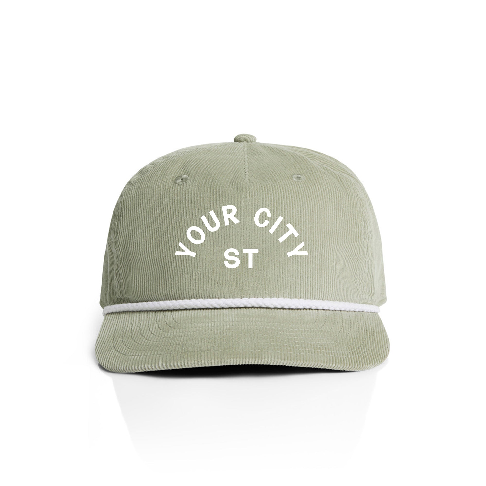 Customizable green corduroy cap with 'YOUR CITY STATE' text on a white background