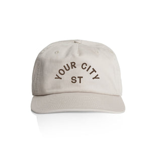 Customizable off white cap with 'YOUR CITY STATE' dark brown text on a white background