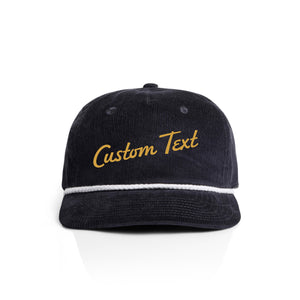 Navy corduroy cap with 'Custom Text' in yellow on a white background