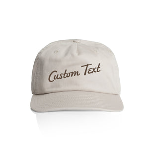 Customizable off white cap with 'Custom Text' in dark brown on a white background