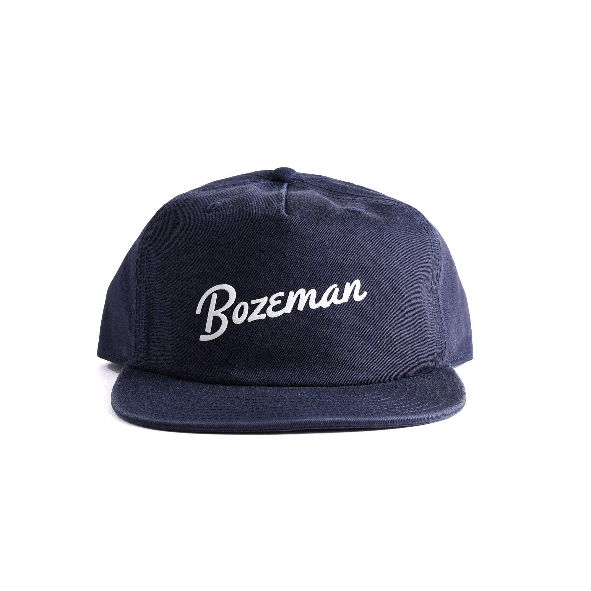 Customizable navy blue cap with 'Bozeman' script text on a white background